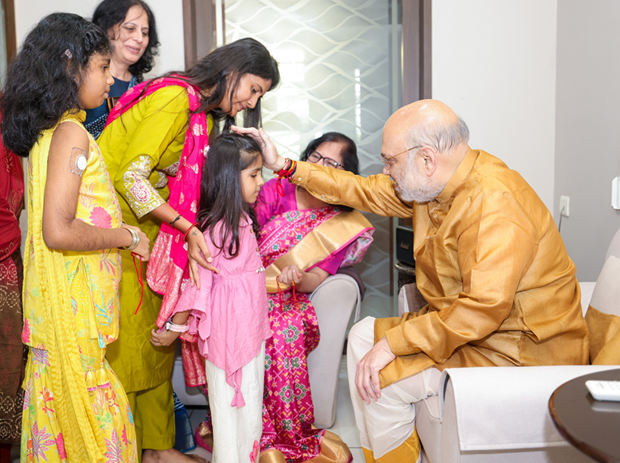 Amit Shah celebrates auspicious festival of Raksha Bandhan in Ahmedabad with girls from his parliamentary constituency who are suffering from Type-1 diabetes